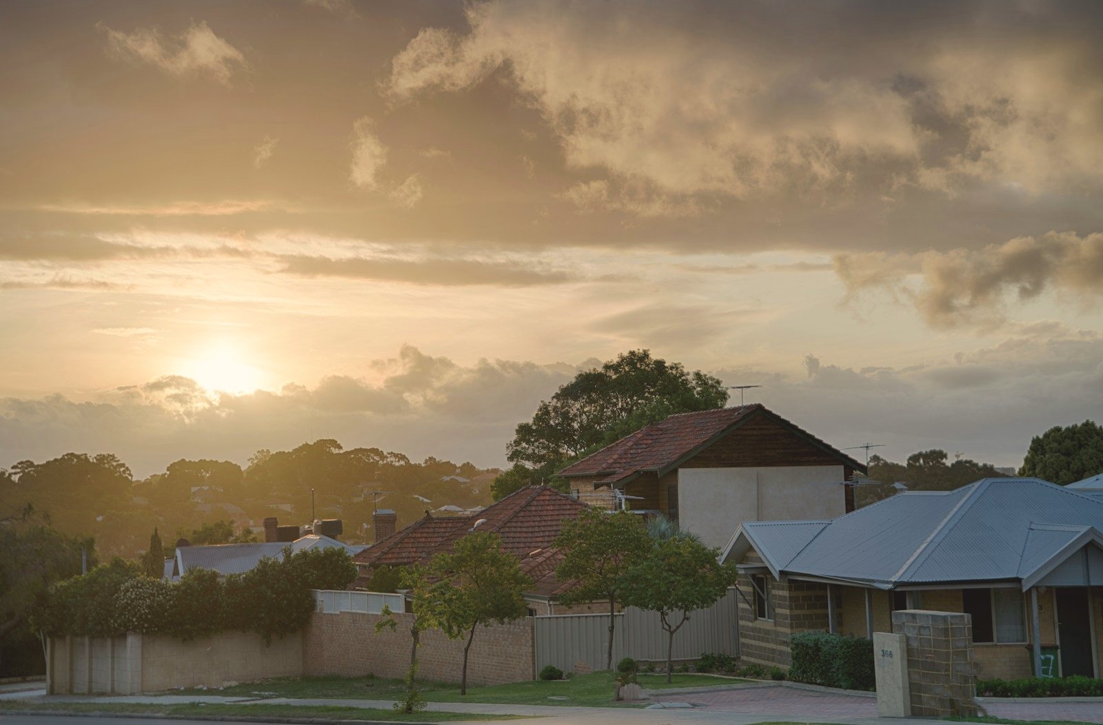 Brick home facade at sunset